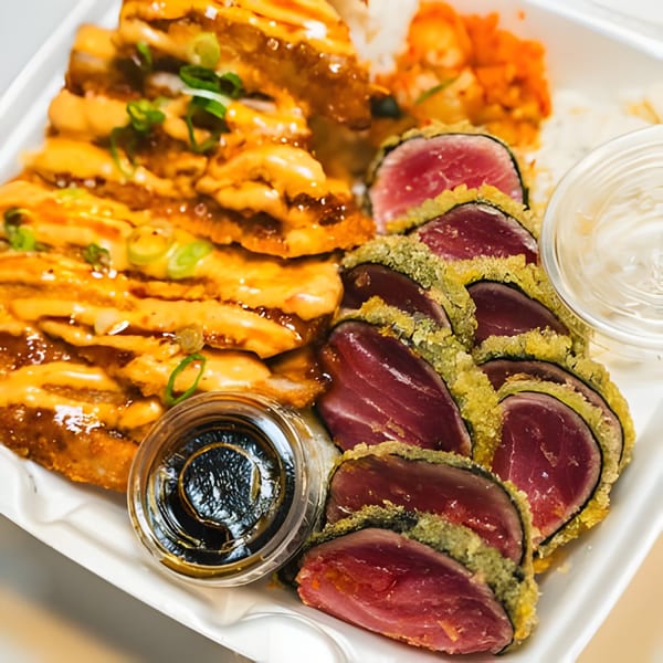 Hawaiian plate lunch with crispy chicken, seared tuna, rice, and two dipping sauces.
