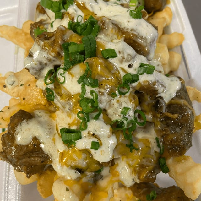 Pastele Fries Topped w/cheese.